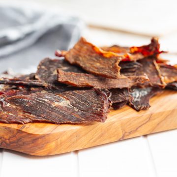 Ground deer jerky slices on a cutting board
